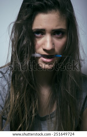 problem depressioned teenage with messed hair and sad face, junky with syringe