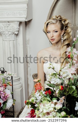 beauty young bride alone in luxury vintage interior with a lot of flowers close up, wedding style
