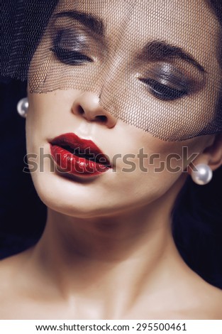 beauty brunette woman under black veil with red manicure close up, grieving widow, halloween makeup