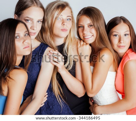 many girlfriends hugging celebration on white background, smiling talking chat close up