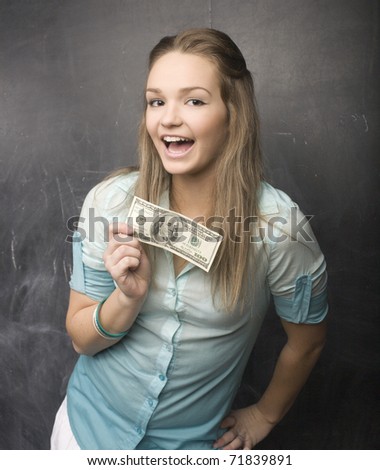portrait of happy cute girl with money