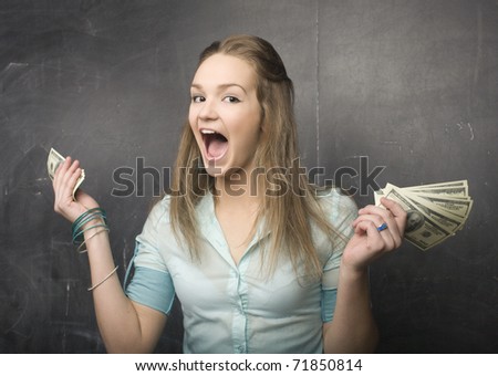 portrait of cute girl student with money