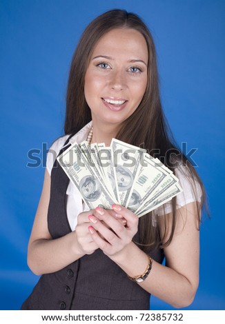 portrait of beautiful young woman with money