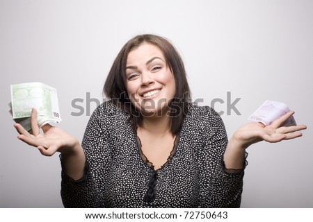 portrait of funny young woman with money, planning shopping