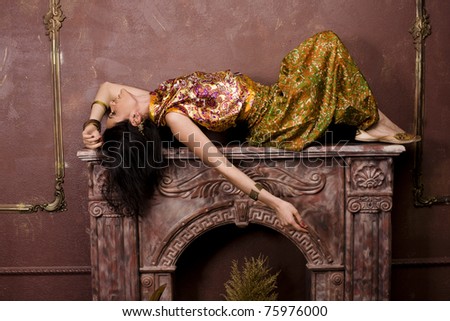 portrait of beauty sensual young woman in oriental style in luxury room