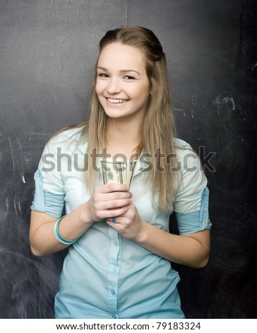 portrait of happy cute girl with money
