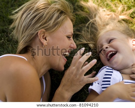 portrait of happy family mother with daughter in garden
