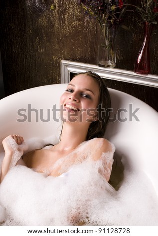 beautiful woman in bathroom antiques holding mirror