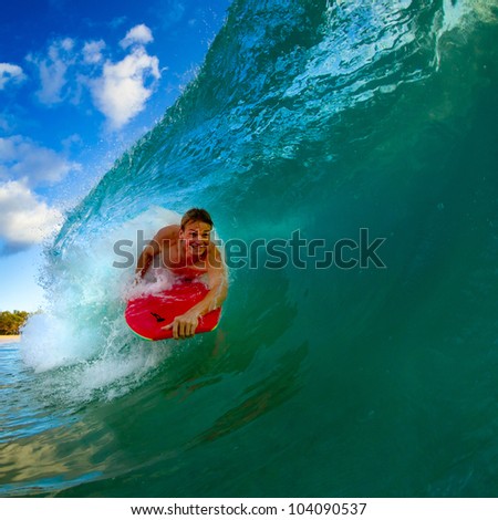 Boogie boarder riding a wave in the summer