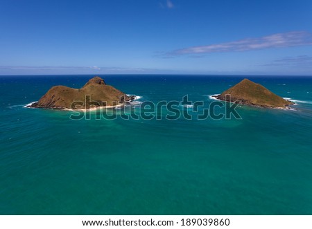 Aerial overview of Oahu's coastal islands and bright blue waters