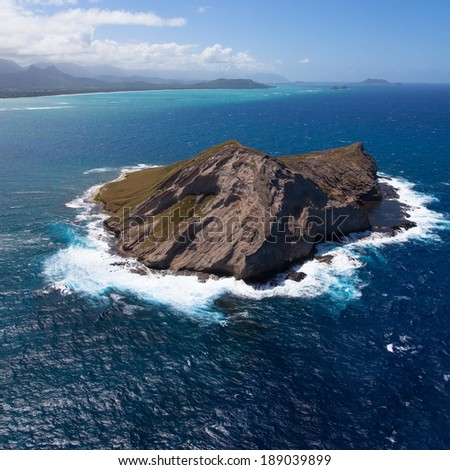 Aerial overview of Oahu\'s coastal islands and bright blue waters