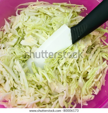 Ceramic knife and chopped cabbage.