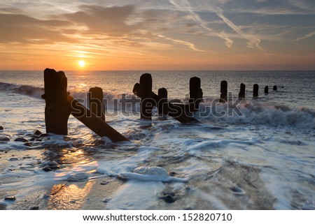 Spurn Point sea breakers (groynes) at dawn, East Yorkshire