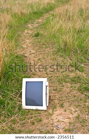 Old monitor in the meadow