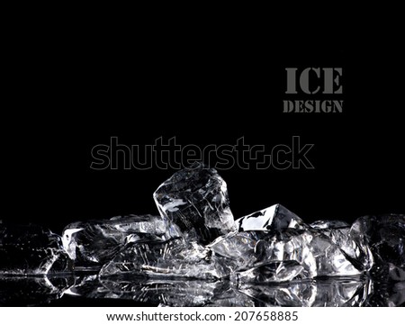 pile of different ice cubes on reflection table on black background