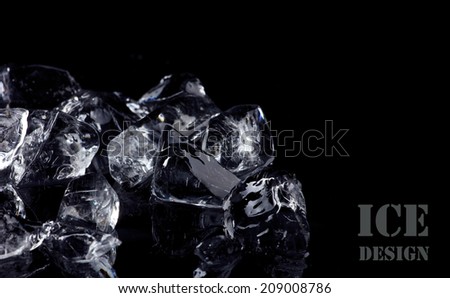 pile of different ice cubes on black background