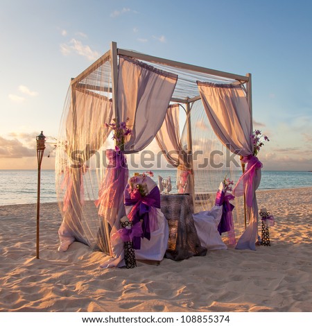 Beautiful Decorated Romantic Wedding Table On Sandy Tropical Caribbean Beach At Sunset