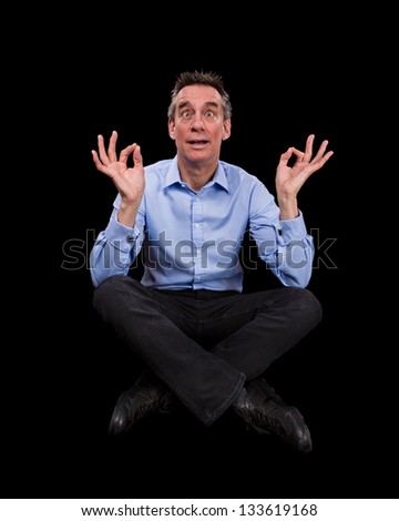 Handsome Middle Age Business Man Meditating Pulling Funny Face Black Background