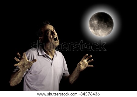 Scary Man Turning into Werewolf or Beast Under a Glowing Full Moon perhaps at Halloween