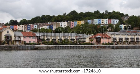 A row of colourful houses alongside the River Avon in Clifton, Bristol, England.