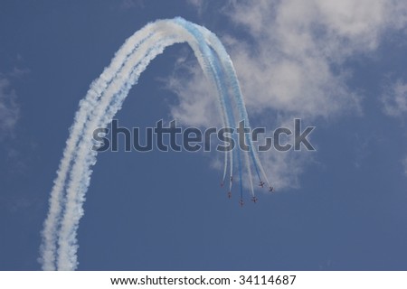 Red arrows leaving a trail of smoke across the sky