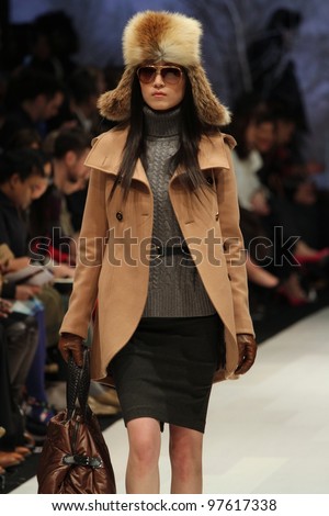 TORONTO - MARCH 13: A model walks the runway in the Soia & Kyo runway show for the Fall/Winter 2012 season at Toronto\'s World Mastercard Fashion Week on March 13, 2012 in Toronto, Canada.