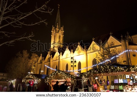 BUDAPEST - DECEMBER 5. : Christmas fair stands on the Saint Stephen square next to a catholic church in Ujpest on December 5., 2014. in Budapest.