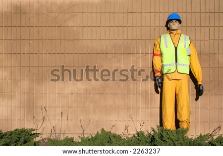 A male dummy wearing protective safety gear.