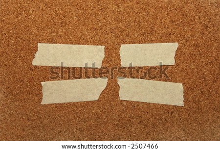 Strips of masking tape on a cork background.