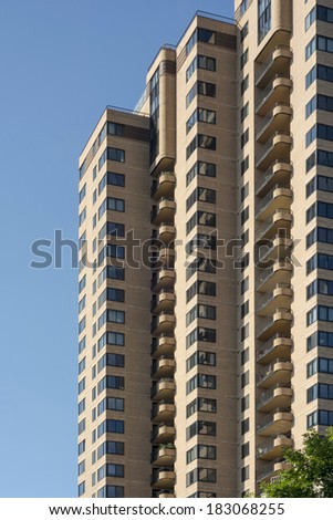 High rise apartment complex against a clear blue sky