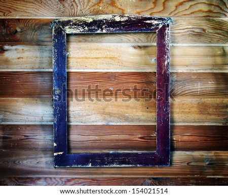 Old vintage wooden frame hanging on the wall