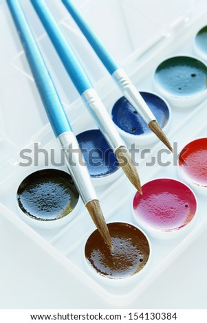 Set of paintbrushes and watercolor