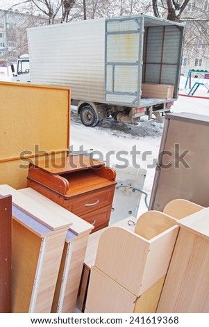 Flat moving. Furniture stands outdoor near the truck