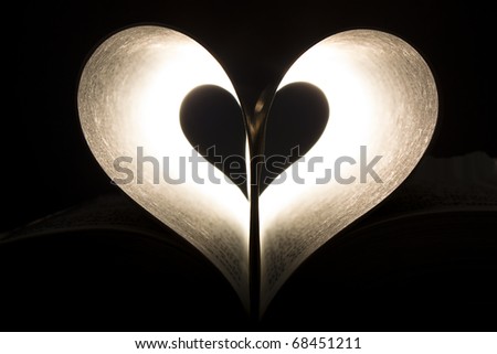 Heart shape formed in the pages of a book