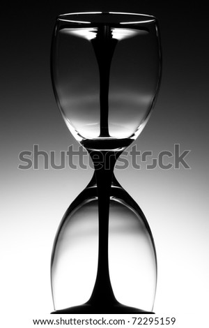 Two wine glasses in the form of an hour glass