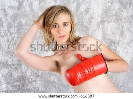 Pretty naked blond woman with red boxing gloves