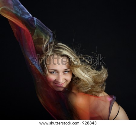 Erotic blond woman with blowing hairs and foulards