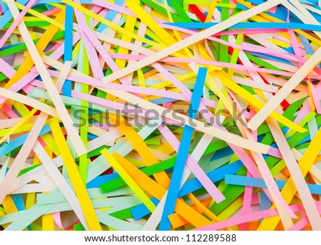 the background of the strips of colored paper