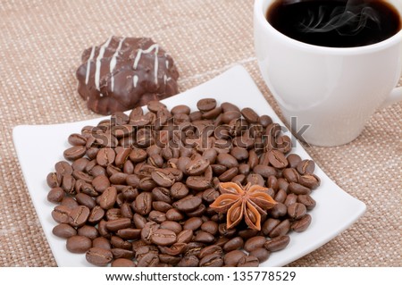 coffee grain and caramel on a saucer with a Ã?Â?Ã?Â�up of coffee and biscuits