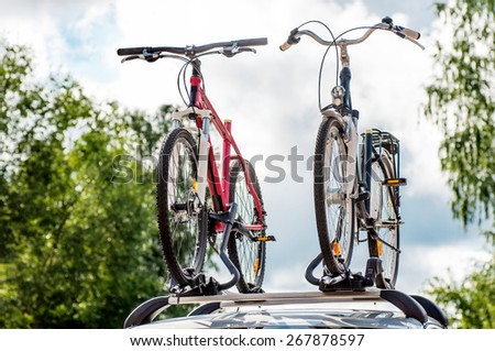two bikes on the trunk of the car