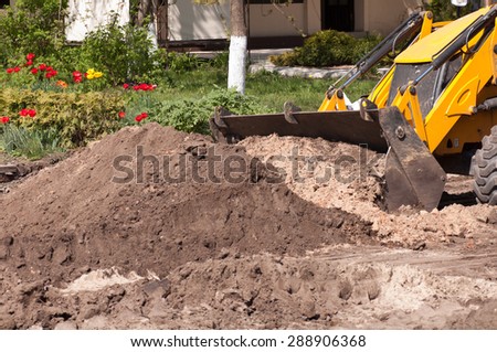 excavator works with the earth closeup