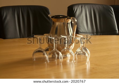 Two leather chairs in executive boardroom prior to a meeting or interview
