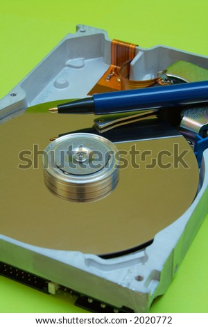 Close-up view of computer hard disk drive plus Pen