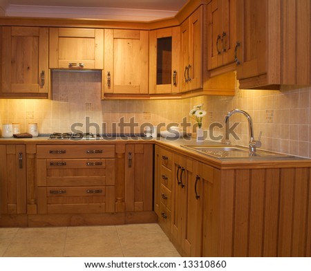 Warm Modern contemporary kitchen design worktop and cupboards in showroom
