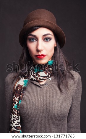 portrait picture of a beautiful young model with blue eyes on grunge background