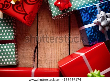 border made by gift packages on wooden background