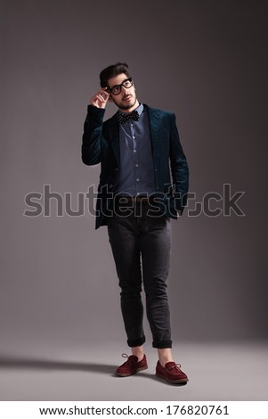hipster style dressed young guy posing for camera