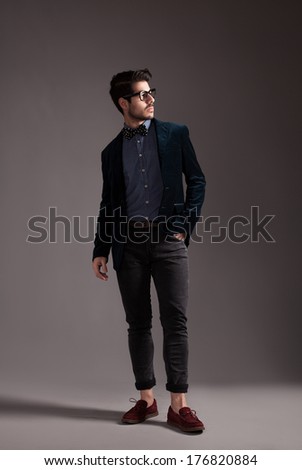 hipster style dressed young guy posing for camera