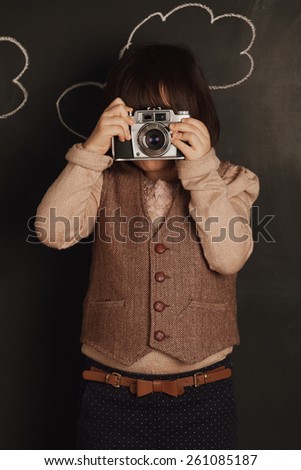 cute little girl wants to be a photographer