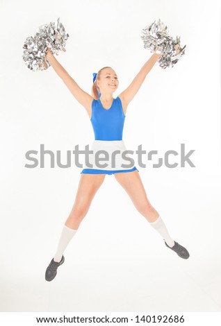 portrait of pretty active young cheerleader